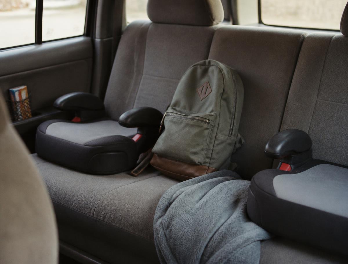 Family car interior with tidy school bags and snack pouches